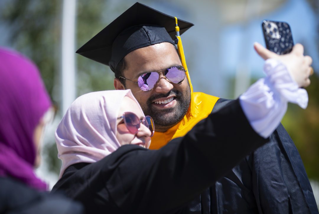 Ebrahim Abdulsattar takes a selfie with wife Lubna Al Sebaie while celebrating his master’s degree during August’s University of Nebraska at Omaha graduation ceremony. Abdulsattar, who grew up in Yemen, graduated high school, college and then got his advanced degree in Nebraska thanks to his own hard work and a serious helping hand from an Omaha couple.