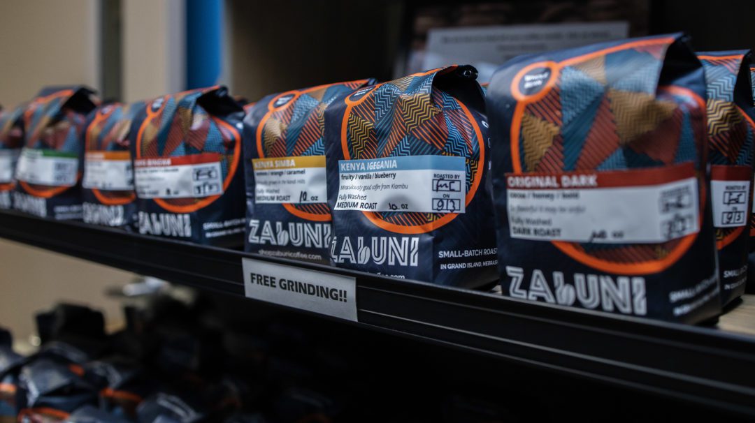 Bags of Zabuni coffee sitting on a shelf.
