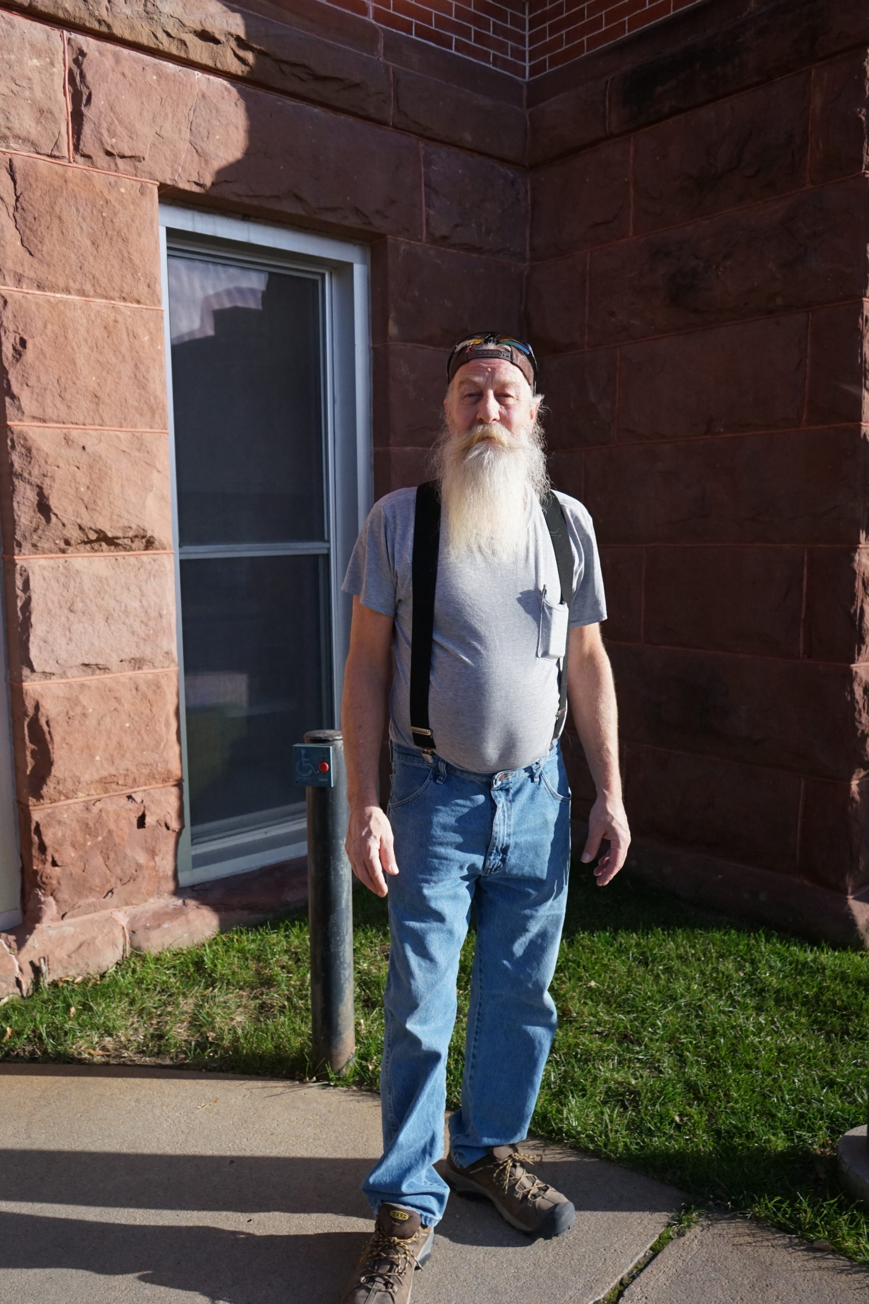 Dennis Tempelmeyer poses in front of the Cass County Courthouse. He and village resident Cathina Reeves sued the Alvo Village Board for refusing to hold a recall election. The judge ruled in the plaintiffs’ favor and compelled the board to hold a special election slated for February. Yanqi Xu/Flatwater Free Press 