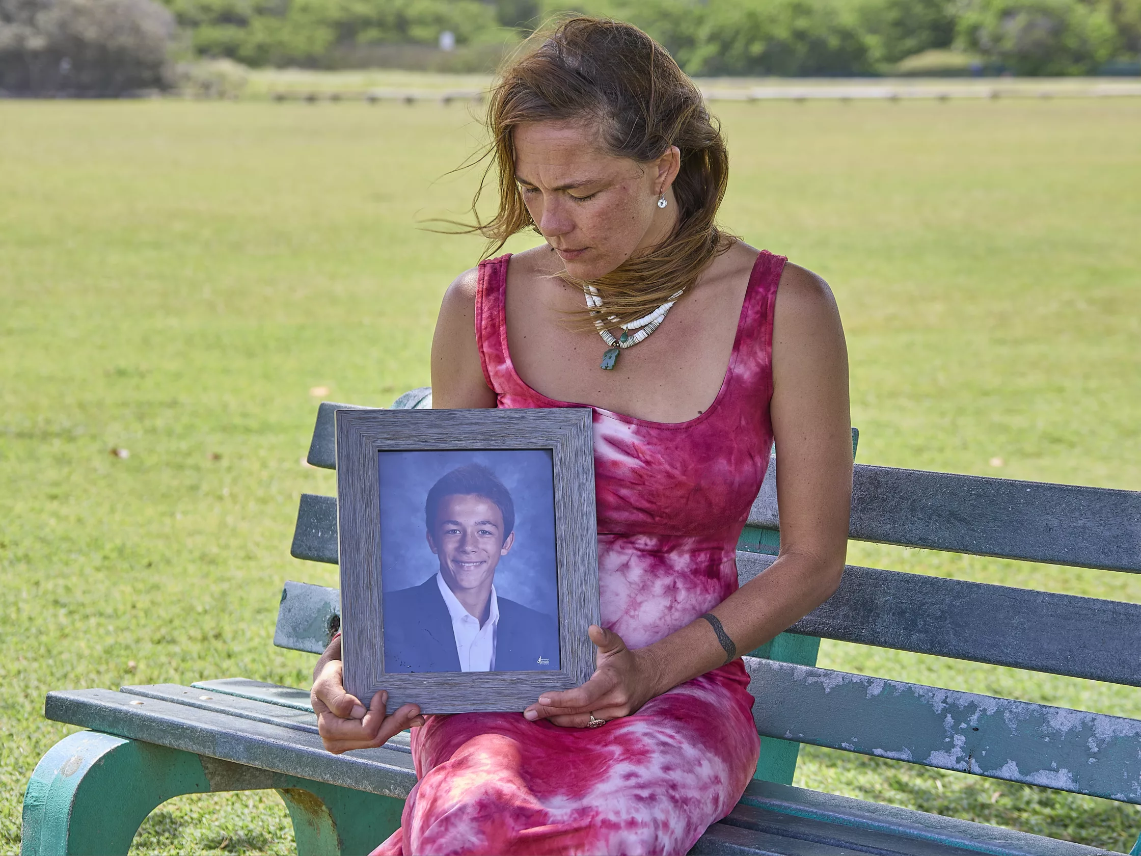 Kuuleilani Zalopany holds a photo of her son, Kalani, shot and killed in 2020.