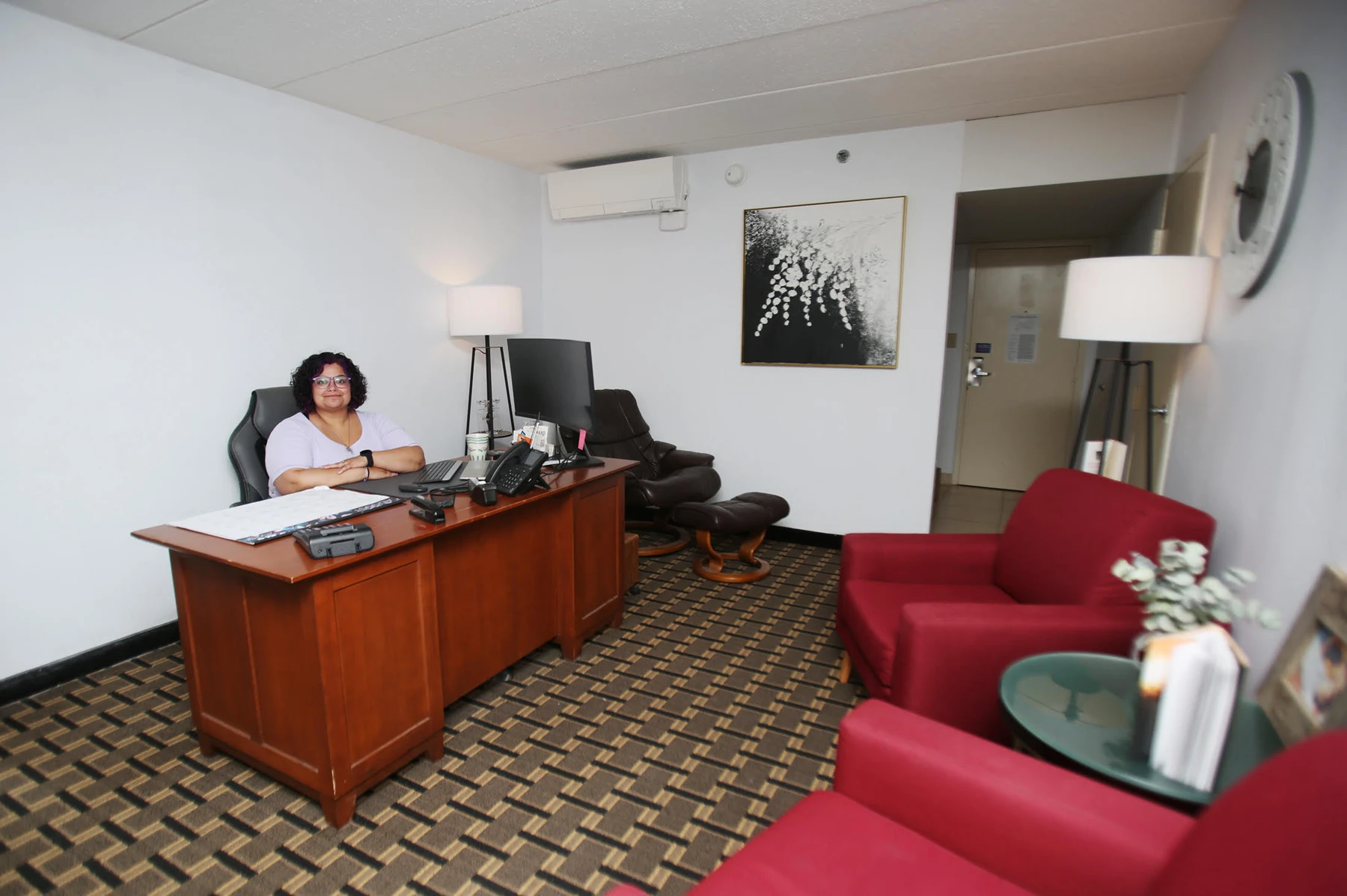 Lindsey Lyons, a counselor at Revive Inc. in Hastings, is pictured in an office at the new headquarters. A hotel and convention center was renovated to accommodate detox, short- and long-term stays and group meetings.